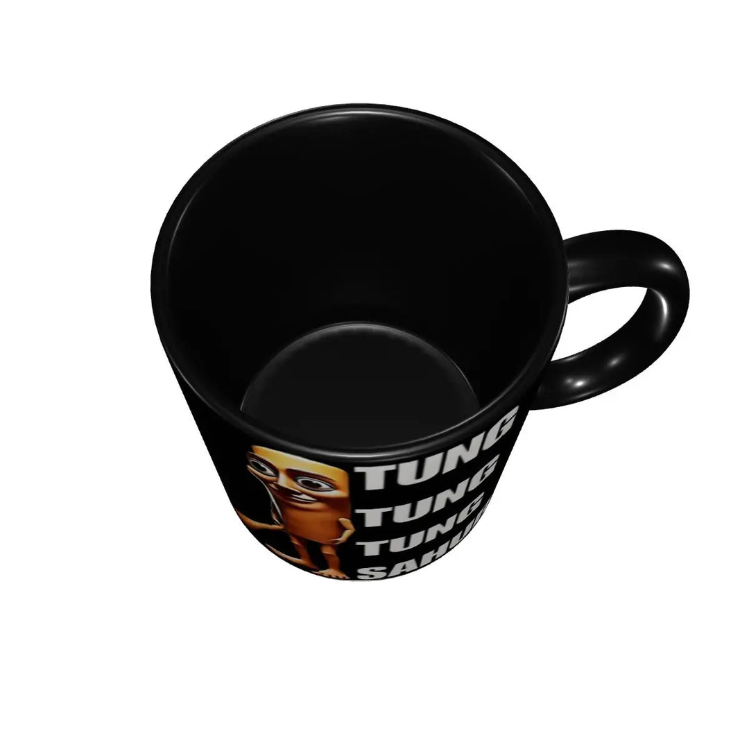 Top view showing the inside of a black coffee mug featuring a cartoon character illustration and bold white text design.