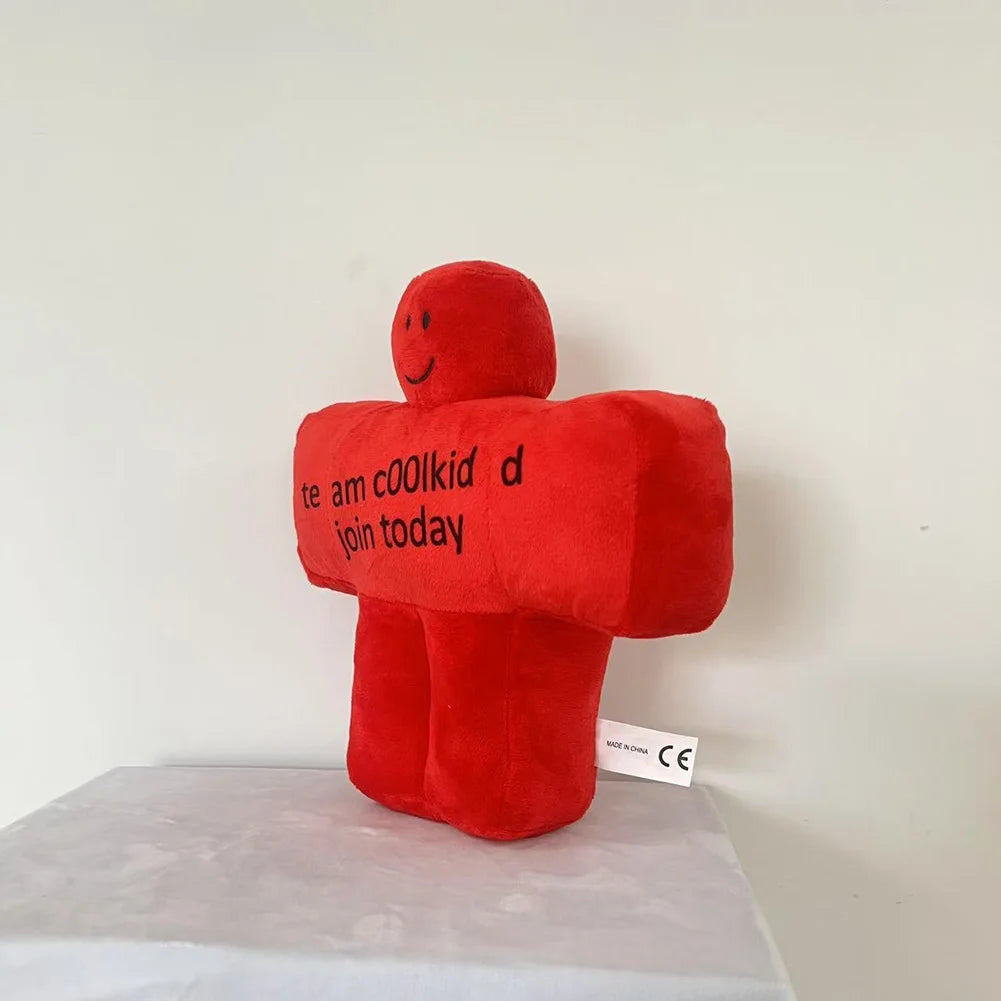 Red plush toy with text on a white background