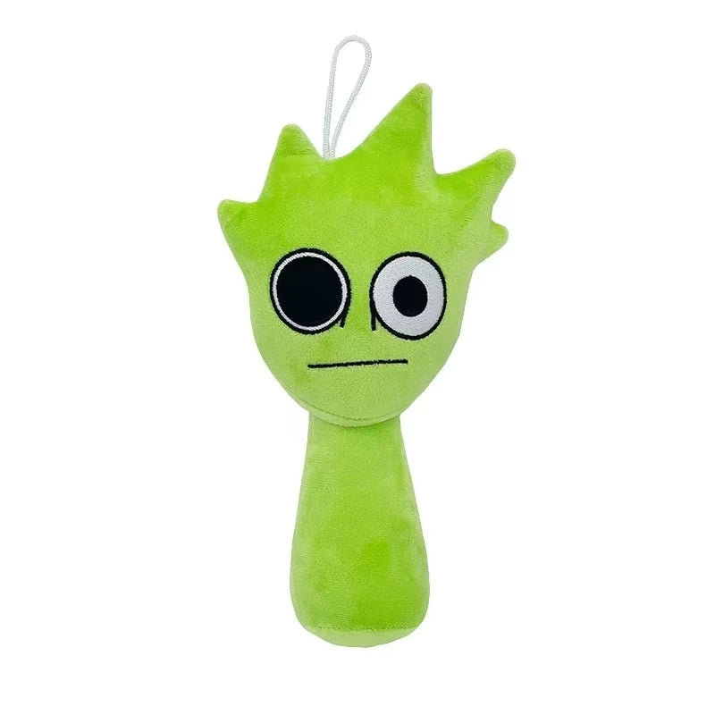 Green plush toy with large eyes on a white background