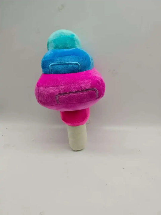Plush ice cream toy with blue top and pink base on a white background