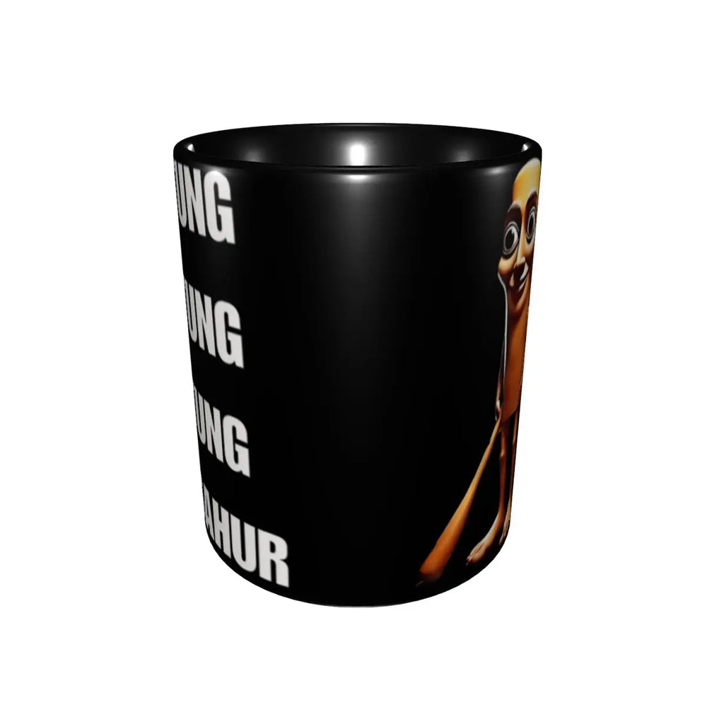 A black ceramic mug featuring a full-body cartoon character on the side and repeated white block text on the opposite side, shown against a white background.