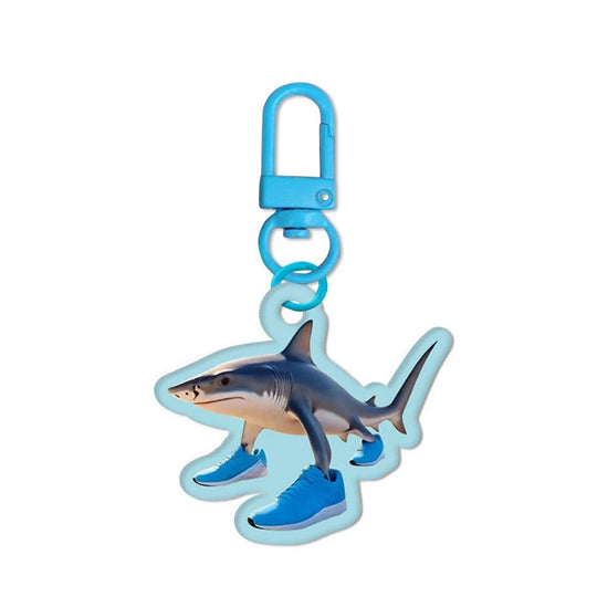 Shark-shaped keychain with blue accents on a white background