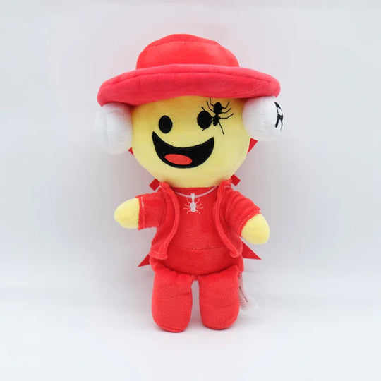 Plush toy with a yellow face, red hat, and outfit on a white background