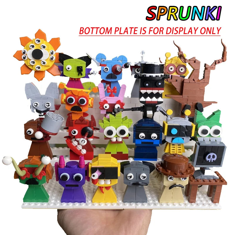 Collection of colorful toy figures on a display stand with 'Sprunk!' branding.