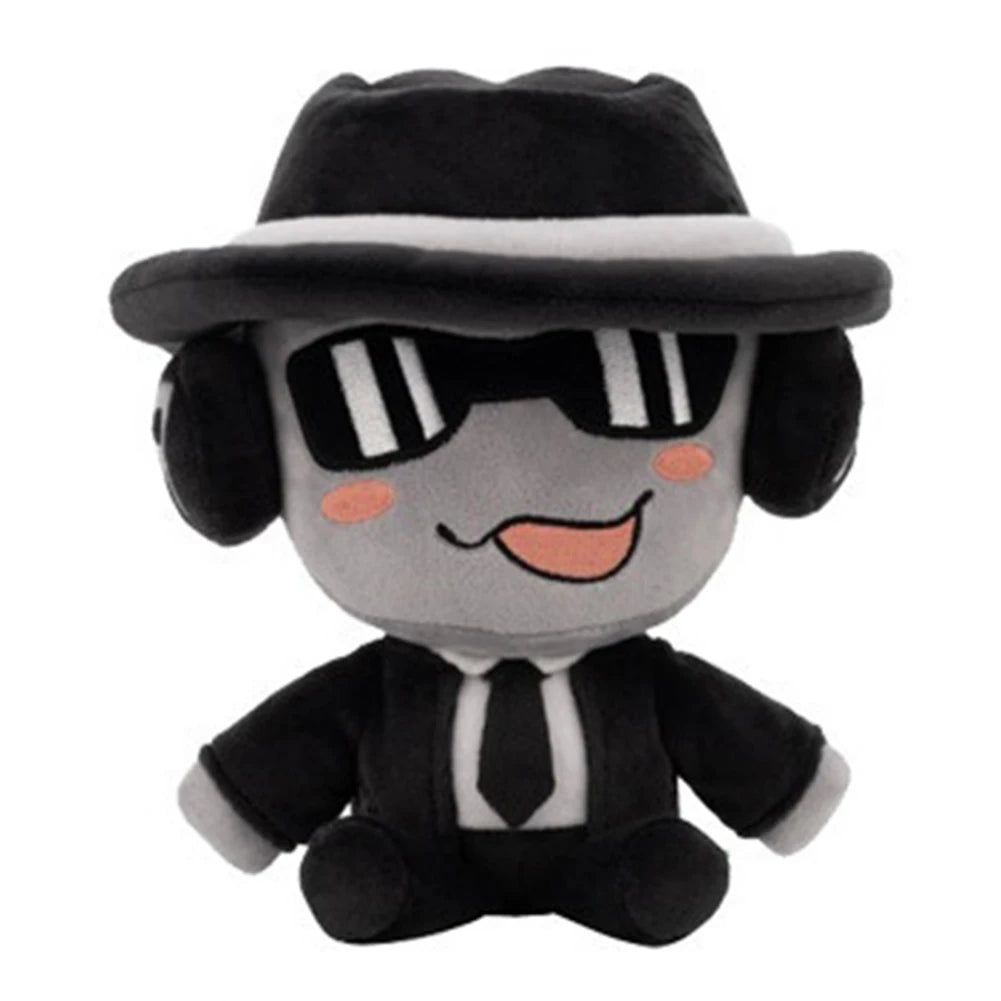 Plush toy resembling a character in a black suit, hat, and sunglasses on a white background