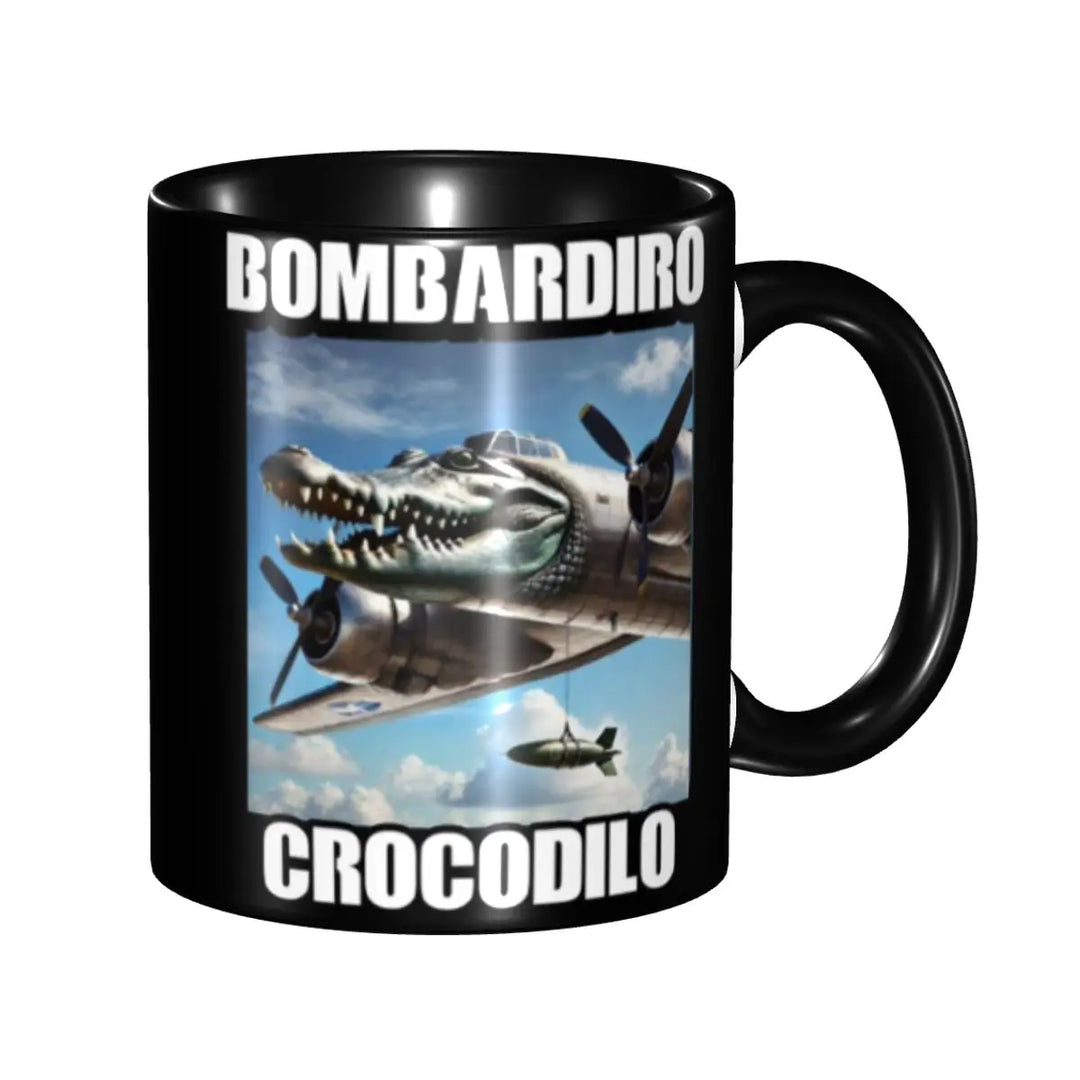 Tilted black ceramic mug with the text ‘BOMBARDINO CROCODILO’ and a whimsical illustration of a crocodile merged with an airplane flying against a blue sky background.