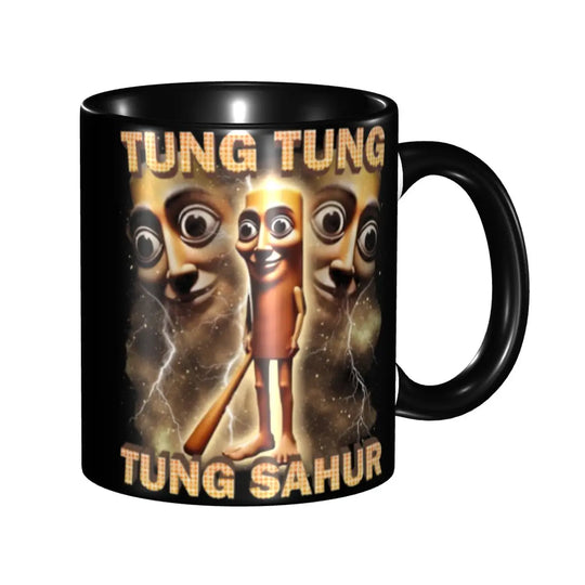 Product image of a black ceramic coffee mug featuring the ‘BOmbradino crocodilo’ text and a whimsical crocoplane graphic with a blue sky background on a white backdrop.