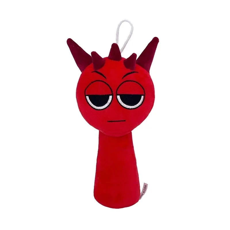 Red plush toy with a devil face on a white background