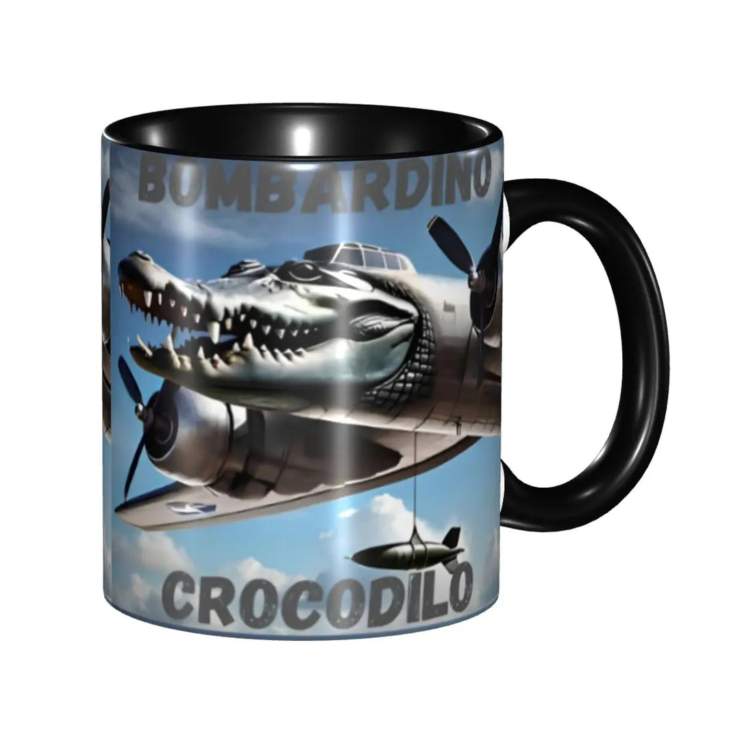 Black coffee mug featuring the text ‘BOMBRADINO CROCODILO’ and a crocodile–airplane hybrid illustration flying in a blue sky background.